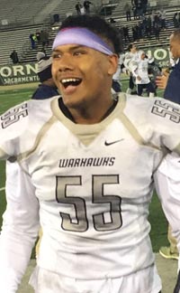 All-American LB Sampson Niu looks to family in the stands after final seconds of Madison's state title win. Photo: Mark Tennis.