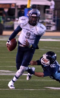 Madison QB Terrell Carter is about to get tackled by Valley Christian's Trent Laubach on scramble play during CIF D2-AA state final. Photo: Phillip Walton/SportStars.