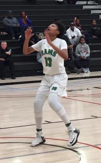 Freshman Amaya Oliver waits for ball to drop through the net for St. Mary's of Stockton during game at the West Coast Jamboree. Photo: Harold Abend.